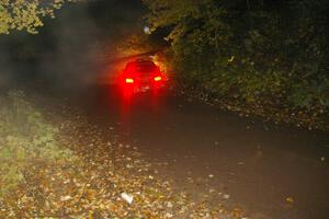 Vio Dobasu / Rob Amato head downhill on Menge Creek, SS9, in their Subaru WRX STi.