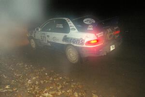 Mason Moyle / Scott Putnam head downhill in the twisty section of Menge Creek, SS9, in their Subaru Impreza.