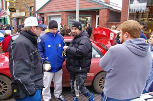 Mark Williams, unknown, Alex Gelsomino and Ben Slocum converse at Saturday morning's parc expose.