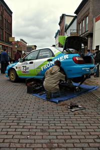 The Pete Hascher / Scott Rhoades Subaru WRX gets last minute repairs at Saturday morning's parc expose.