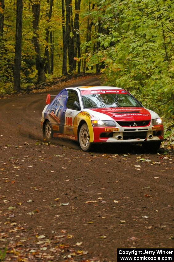 Arkadiusz Gruszka / Lukasz Wronski drift through a sweeper near the finish of Beacon Hill, SS2, in their Mitsubishi Lancer Evo 9