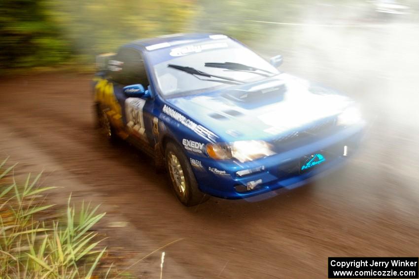 The Piotr Fetela / Dariusz Belzowski Subaru Impreza at speed near the finish of SS2, Beacon Hill.