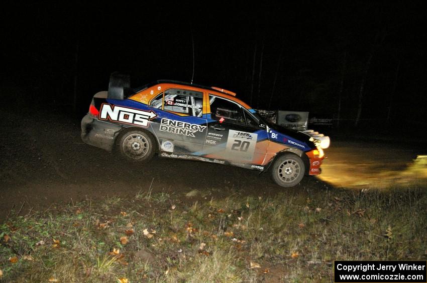 Andrew Comrie-Picard / Jeremy Wimpey drift their Mitsubishi Lancer Evo 9 through the spectator corner on Far Point 2, SS7.