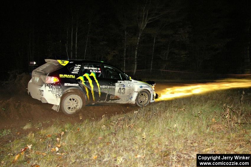 Ken Block / Alex Gelsomino drift through the spectator corner on Far Point 2, SS7, in their Subaru WRX STi.