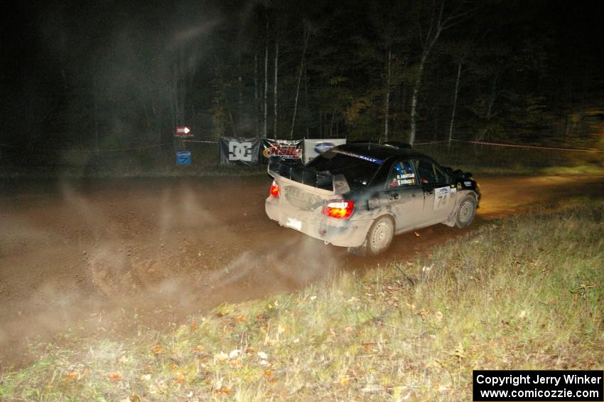 Vio Dobasu / Rob Amato drive through the spectator corner on Far Point 2, SS7, in their Subaru WRX STi.