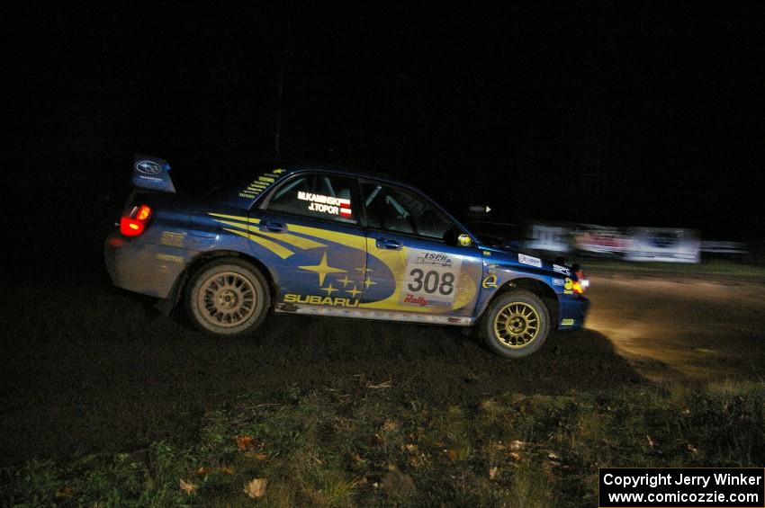 Janusz Topor / Michal Kaminski drift their Subaru WRX STi through the spectator corner on Far Point 2, SS7.