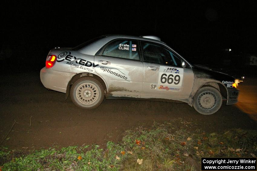 Evan Cline / Jason Grahn drift through the spectator corner on Far Point 2, SS7, in their Subaru Impreza.