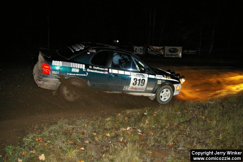 Chris Greenhouse / Don DeRose drift through the spectator corner on Far Point 2, SS7, in their Plymouth Neon.