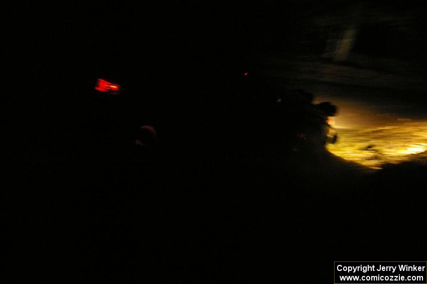 Travis Pastrana / Christian Edstrom head downhill with glowing brake rotors on Menge Creek, SS9, in their Subaru WRX STi.