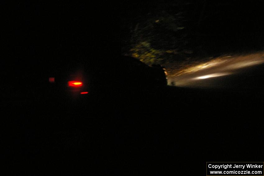 Andi Mancin / Maciej Wislawski head downhill at speed on Menge Creek, SS9, in their Mitsubishi Lancer Evo 9.