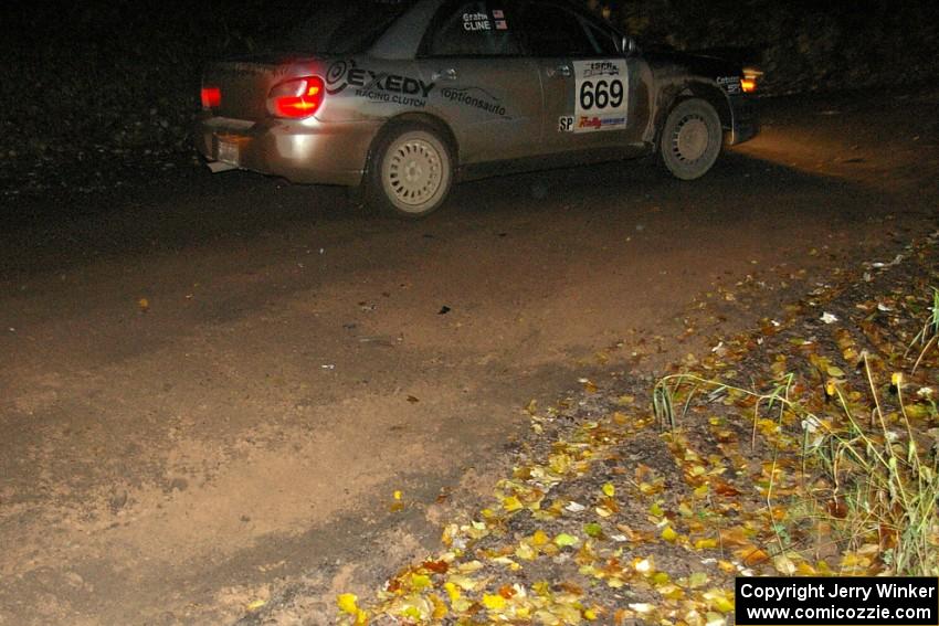 Evan Cline / Jason Grahn drift through a fast sweeper near the midpoint of Menge Creek, SS9, in their Subaru Impreza.