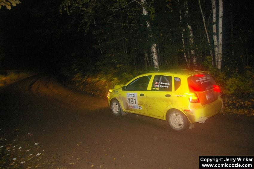 Jim Stevens / Marianne Stevens head downhill at speed on Menge Creek, SS9, in their Suzuki Swift.