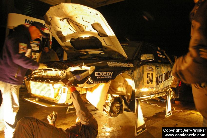 Mark Fox / Jake Blattner get repairs to their Subaru WRX STi under an awning of a closed gas station in Baraga at 2AM. (1)