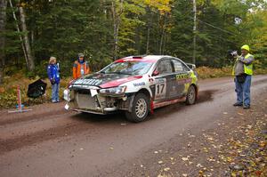 Antoine L'Estage / Nathalie Richard blast away from the start of Delaware 1, SS11, in their Mitsubishi Lancer Evo X.