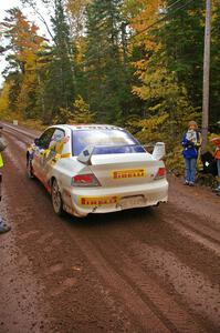 Andi Mancin / Maciej Wislawski rocket away from the start of Delaware 1, SS11, in their Mitsubishi Lancer Evo 9.