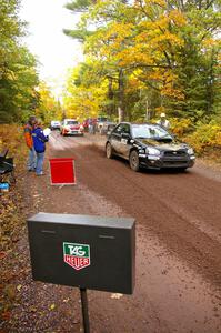 Pat Moro / Ole Holter blast away from the start of Delaware 1, SS11, in their Subaru WRX STi.