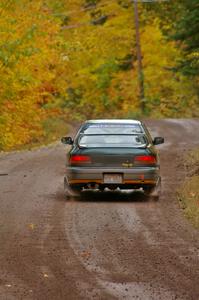 Jaroslaw Sozanski / Bartosz Sawicki head uphill at speed from the start of Delaware 1, SS11, in their Subaru Impreza RS.