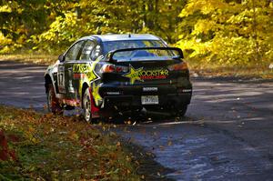 Antoine L'Estage / Nathalie Richard go uphill after the midpoint jump on Brockway Mtn. 1, SS13, in their Mitsubishi Lancer Evo X