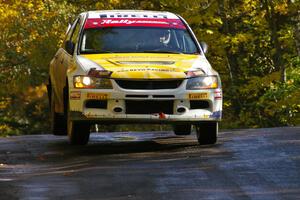 Andi Mancin / Maciej Wislawski catch air at the midpoint jump on Brockway Mtn. 1, SS13, in their Mitsubishi Lancer Evo 9.