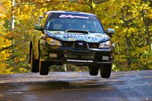 Mark Fox / Jake Blattner catch nice air at the midpoint jump on Brockway Mtn. 1, SS13, in their Subaru WRX STi.