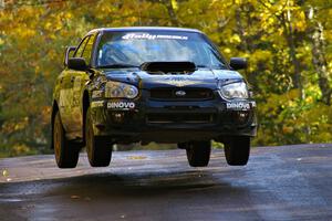 Pat Moro / Ole Holter catch nice air at the midpoint jump on Brockway Mtn. 1, SS13, in their Subaru WRX STi.