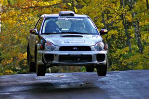 Evan Cline / Jason Grahn catch nice air at the midpoint jump on Brockway Mtn. 1, SS13, in their Subaru Impreza.