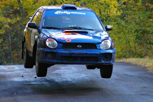 Tim Penasack / Alex Kihurani catch nice air at the midpoint jump on Brockway Mtn. 1, SS13, in their Subaru WRX.