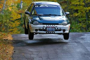 Chris Greenhouse / Don DeRose catch nice air in their Plymouth Neon on the midpoint jump of Brockway Mtn. 1, SS13.