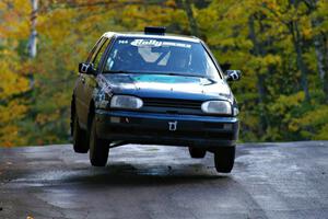 Paul Koll / Tim Knorr catch air at the midpoint jump on Brockway Mtn. 1, SS13, in their VW Golf.