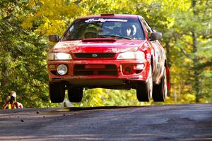 Dustin Kasten / Corina Soto catch nice air in their at the midpoint jump on Brockway Mtn. 1, SS13, in their Subaru Impreza.
