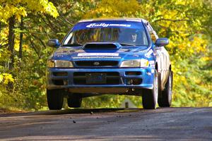 Piotr Fetela / Dariusz Belzowski catch a little air at the midpoint jump on Brockway Mtn. 1, SS13, in their Subaru Impreza.