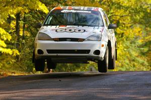 Dillon Van Way / Ben Slocum catch nice air at the midpoint jump on Brockway Mtn. 1, SS13, in their Ford Focus.