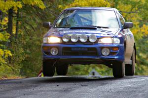 Kazimierz Pudelek / Michal Nawracaj catch a little air at the midpoint jump on Brockway Mtn. 1, SS13, in their Subaru Impreza.