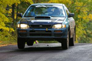 Don Kennedy / Matt Kennedy catch a little air at the midpoint jump on Brockway Mtn. 1, SS13, in their Subaru Impreza.