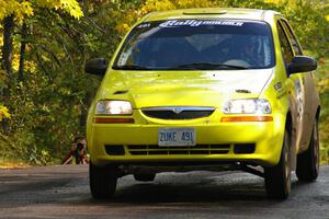 Jim Stevens / Marianne Stevens get the backend light at the midpoint jump on Brockway Mtn. 1, SS13, in their Suzuki Swift.