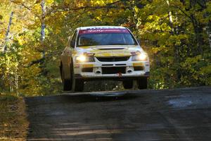 Andi Mancin / Maciej Wislawski catch air at the midpoint jump on Brockway Mtn. 2, SS16, in their Mitsubishi Lancer Evo 9.