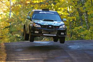 Mark Fox / Jake Blattner catch nice air at the midpoint jump on Brockway Mtn. 2, SS16, in their Subaru WRX STi.