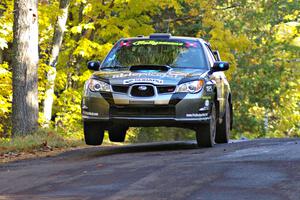 Jimmy Keeney / Missy Keeney catch a little air at the midpoint jump on Brockway Mtn. 2, SS16, in their Subaru WRX STi.