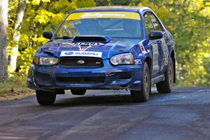 Kenny Bartram / Dennis Hotson take it easy at the midpoint jump on Brockway 2, SS16, in their Subaru WRX STi.