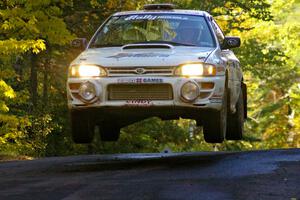 Henry Krolikowski / Cindy Krolikowski catch nice air in their Subaru Impreza on the midpoint jump on Brockway Mtn. 2, SS16.