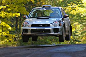 Evan Cline / Jason Grahn catch nice air at the midpoint jump on Brockway Mtn. 2, SS16, in their Subaru Impreza.