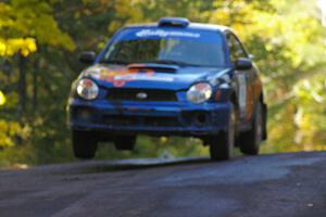 Tim Penasack / Alex Kihurani catch air at the midpoint jump on Brockway Mtn. 2, SS16, in their Subaru WRX.