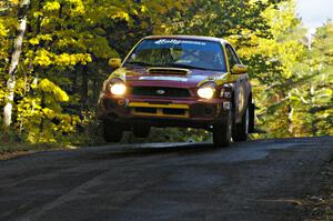 Bryan Pepp / Jerry Stang catch air at the midpoint jump on Brockway Mtn. 2, SS16, in their Subaru WRX.