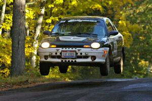Chris Greenhouse / Don DeRose catch nice air in their Plymouth Neon at the midpoint jump of Brockway Mtn. 2, SS16.