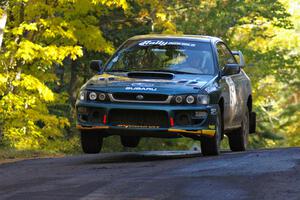 Jaroslaw Sozanski / Bartosz Sawicki catch a little air in their Subaru Impreza RS at the midpoint jump on Brockway Mtn. 2, SS16.