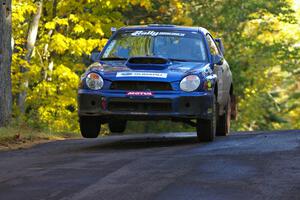 The Janusz Topor / Michal Kaminski Subaru WRX STi catches air at the midpoint jump on Brockway Mtn. 2, SS16.