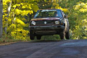 Matt Bushore / Andy Bushore catch air at the midpoint jump on Brockway Mtn. 2, SS16, in their VW Jetta.