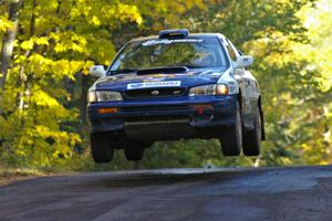 Mason Moyle / Scott Putnam catch air at the midpoint jump on Brockway Mtn. 2, SS16, in their Subaru Impreza.