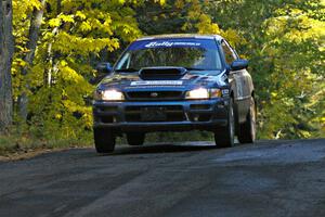 The Piotr Fetela / Dariusz Belzowski Subaru Impreza gets minimal air at the midpoint jump on Brockway 2, SS16.