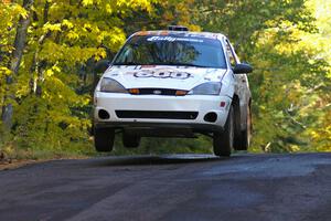 Dillon Van Way / Ben Slocum catch nice air at the midpoint jump on Brockway Mtn. 2, SS16, in their Ford Focus.